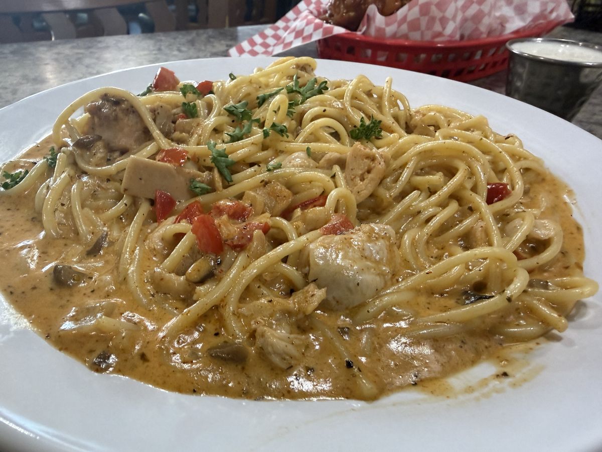 Creamy Cajun pasta with grilled chicken, peppers and mushrooms